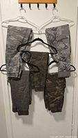 All five jogger pants hanging to show color/pattern variety