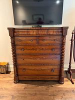 Front view of chest showing five drawers and spiral columns at sides