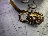 Brass lion head door knocker and part of shoehorn