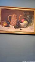 Full view of framed oil painting showing still life subject