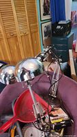 Two chrome adjustable desk lamps in lot