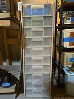 Front view of white plastic 10-drawer organizer shelf