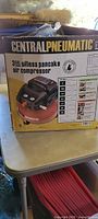 Box showing Central Pneumatic 3 gallon oil-less pancake air compressor branding