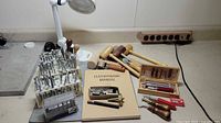 Overview of leatherworking tools, lamp, manual, mallets, punches