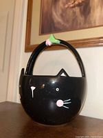 handled black cat face bowl
