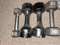 Cast iron 5-lb and 10-lb hex dumbbells plus two 3-lb neoprene dumbbells