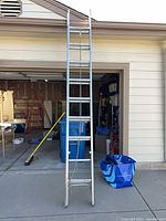 Full view of aluminum extension ladder fully nested