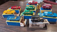 Assorted cars on original blue/yellow boxes and black Simplex on white box