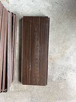 Stack of brown wood-grain shelf panels