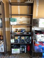 Front view of first brown steel shelving unit with adjustable shelves