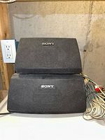 Front view of two Sony speakers stacked