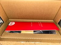 Box containing sealed Dish Network remote with quick-start guide visible