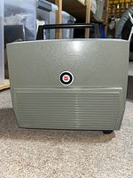GAF projector in grey carrying case with red emblem