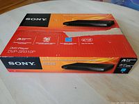Photo of the Sony DVP-SR310P DVD player box from a front angle showing the product image and branding.