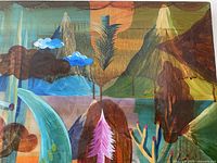 Full view of the abstract surrealist painting showing colorful mountains, clouds, trees, and signature with intentional surface cracks due to automotive glaze.