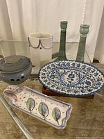 Top view showing all pottery pieces together on glass table