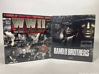 Both VHS box sets side by side, 'WWII Special Edition' and 'Band of Brothers', showing cover art and sealed condition.