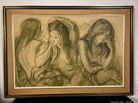 Front view of framed print showing three poses of female figure in soft earthy tones with wooden frame and fabric border.