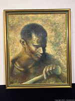 Frontal view of the portrait painting showing the entire artwork and frame, includes visible wood frame with gold tone and the portrait of a man holding a cylindrical object