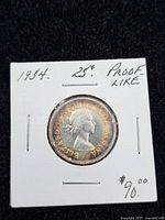 Obverse of 1954 Canadian 25-cent coin showing Queen Elizabeth II in 2×2 holder