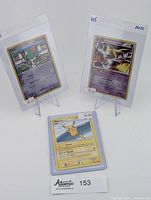Three Pokémon cards displayed, including 2005 Ralts EX Delta Species holo, 2010 Jirachi holo, and 2009 Pikachu non-holo, all sleeved and priced.