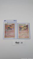 Two Typhlosion holo Pokémon cards in protective sleeves with price tags noted $25 and $16 each.