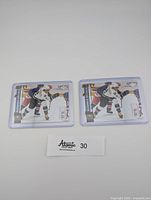 Two Alexander Ovechkin hockey cards in protective cases placed side by side on a white surface, both from Upper Deck 2006-07 series, card number 442.