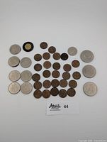 Full layout of 36 Canadian coins including 50 cent coins, Toonie, pennies, quarter and dollar coins