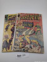 Front covers of both Daredevil comics (#2 and #27) displayed side by side.