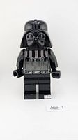 Front view of the Lego Darth Vader alarm clock showing the time on digital display in torso.