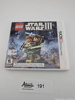 Front cover of the Nintendo 3DS game case for Lego Star Wars III The Clone Wars showing main characters and title.