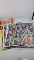 Lot of 8 vintage comic books showing Marvel Dazzler issues and other vintage titles with colorful illustrated covers.