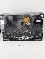 Front view of the sealed Misa Amane figurine in box showing the figurine inside and Death Note branding.