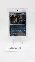 Photo of Umbreon Masterball Reverse Holo Pokemon card in protective sleeve on stand with price tag $105