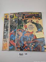 Front view of three Superman's Pal Jimmy Olsen comics in plastic sleeve, showing issue #135 cover with detailed artwork featuring Darkseid