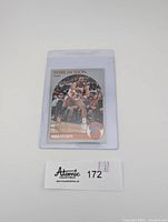 Front of the Mark Jackson NBA Hoops basketball card, showing player in New York Knicks uniform with crowd and Menendez Brothers in the background.