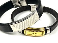 Two bracelets displayed side-by-side showing metal plates and bands.