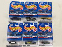Six Hot Wheels cars from the 1998 First Editions series in original blister card packaging. Front view shows six different die-cast cars with blue Hot Wheels branding cards.