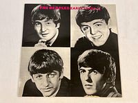 Front cover of The Beatles Early Years vinyl record showing portraits of band members and the title.
