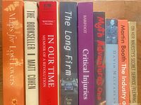 Spines of all nine books showing titles and authors