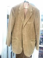Front view of tan corduroy blazer on hanger