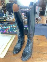 Full view of both boots standing upright on table