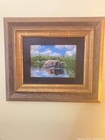 Full view of framed oil painting