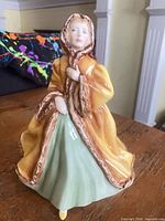 Front view of Royal Doulton Rachel figurine showing cloak and dress detail
