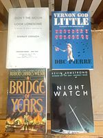 Group shot of all four signed softcover books