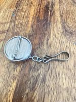 back of retractable watch pin showing pin clasp and spring clip