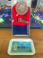 Tray and boxed RCMP wine bottle jacket together