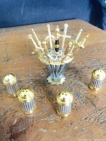 Full set showing sword pick stand with skewers and four shakers