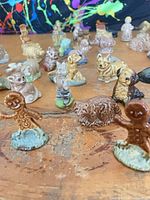Group of Wade figurines, focus on gingerbread men and assorted animals