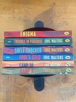 Stack of six Eric Walters Camp X series books showing spines and titles